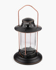 Barebones Vintage-style Hurricane Lantern with clear seaded glass and bronze metal accents on a white background